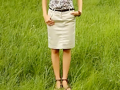 Cute ponytailed girl posing outdoors