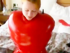 Inflatable red latex sack and gagged mouth
