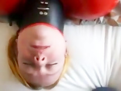 Inflatable red latex sack and gagged mouth