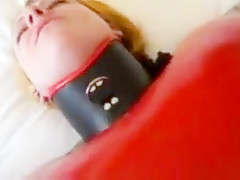 Inflatable red latex sack and gagged mouth