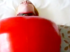 Inflatable red latex sack and gagged mouth