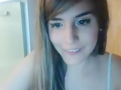Bedroom camgirl removes shorts