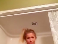 YOUNG BLONDE MASTURBATES IN THE SHOWER