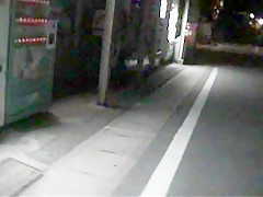 Walking in a midnight town with see-through-dress