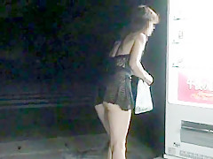 Walking in a midnight town with see-through-dress