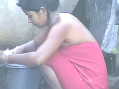 wow... outstanding desi village gal bathing outside