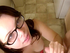 Sexy young brunette removes her red dress to give a tattooed stud a handjob