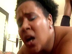 Fat ebony chick works her hot lips and her fiery cunt on a black cock