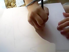 Sweet little brunette Kitty finishes drawing so she can finger her twat