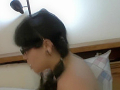 Fat brunette with pigtails fucks a hard prick with fervor on the bed