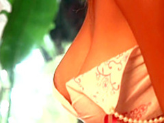 Sexy Marin lies on the bed caressing her big boobs and her tight peach