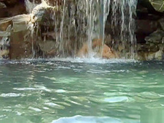 Sexy lesbians play in a beautiful pool and toy their wet pussies