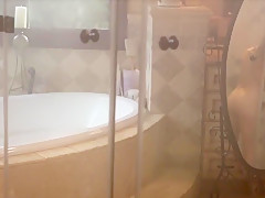 Playboy beauty posing in a shower