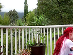 Redhead pornstar teasing outdoors