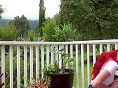 Redhead pornstar teasing outdoors