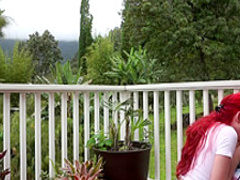 Redhead pornstar teasing outdoors