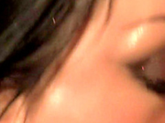 Big breasted Asian slut feeds her hungry holes a huge black stick