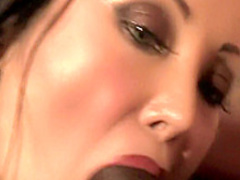 Big breasted Asian slut feeds her hungry holes a huge black stick