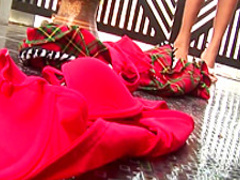 Sweet looking Asian babe in a bikini dances as she gets naked