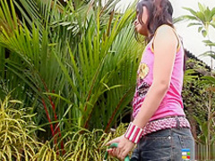 Smoking hot brunette beauty gets playful and buck naked outdoors