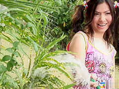 Smoking hot brunette beauty gets playful and buck naked outdoors