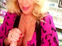 Kinky mature woman with big hooters works her hands on a stick in POV