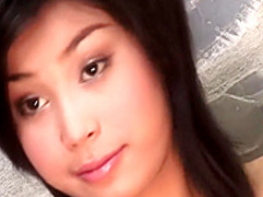 Sensual Oriental babe shows off her lovely boobs and her hairy peach