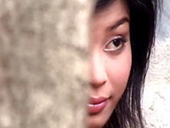 Sensual Oriental babe shows off her lovely boobs and her hairy peach