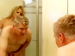 Latex-clad busty wench fucks a horny stud with a strap-on