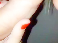 mature blonde sucks at the camera