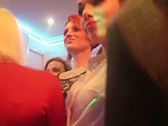 Girls at a party suck on cocks