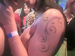 Girls at a party suck on cocks