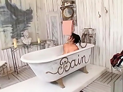 Latin teen Jasmine Black is in her bathtub, washing off her humongous all