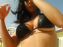 Cute Roxana brings her boobies out to show off