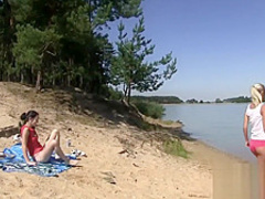Two hot lesbians bang at the beach