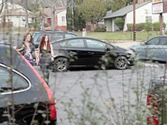 Sexy babes licking each other outdoors