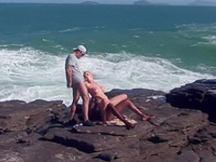 Interracial threesome at the beach