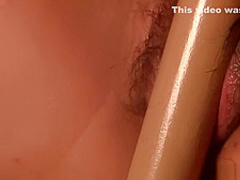 Asian teen massages her hot pussy in private