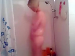 slim blonde records herself in the shower