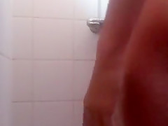 Boy takes a shower and cums against the wall In camping shower