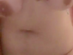 Naked girl enjoying vibrator in the bathroom