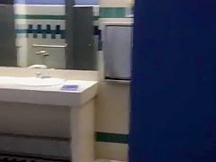 Taking a piss in the urinal at the library