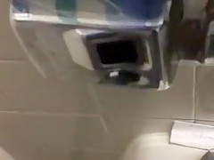 Taking a piss in the urinal at the library