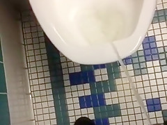 Taking a piss in the urinal at the library