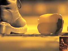 POV crushing of capsicum in shiny Doc Martens combat boots