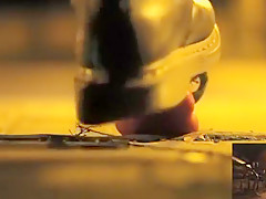 POV crushing of capsicum in shiny Doc Martens combat boots