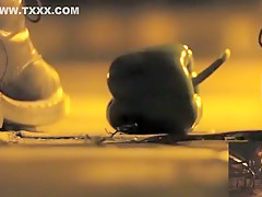 POV crushing of capsicum in shiny Doc Martens combat boots