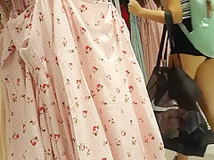 Candid voyeur teen in cheeky shorts clothes shopping