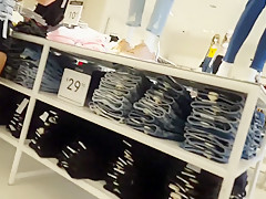 Candid voyeur teen in cheeky shorts clothes shopping