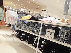 Candid voyeur teen in cheeky shorts clothes shopping